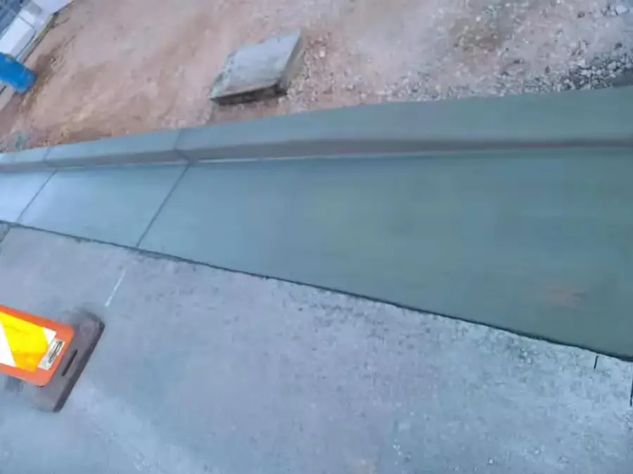 Close view of new concrete curb and gutter along a street edge