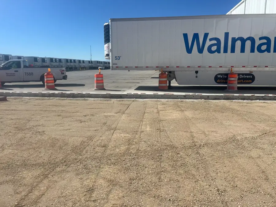 New concrete slab beside a Walmart trailer at the loading docks